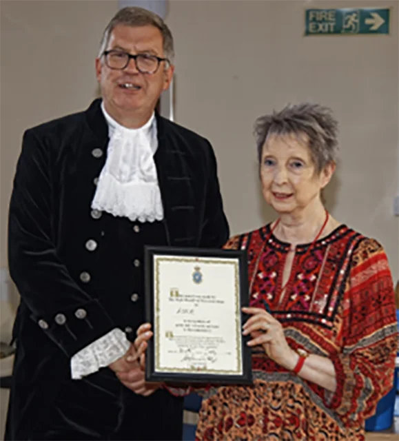 High Sheriff of Worcester presenting Julia with award.