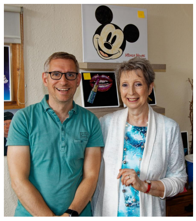 Cllr Matt Jenkins with Julia (ASPIE members' artwork in the background.