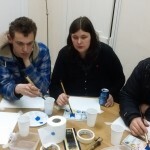 Dan, Joanne and Marcus painting in watercolours.